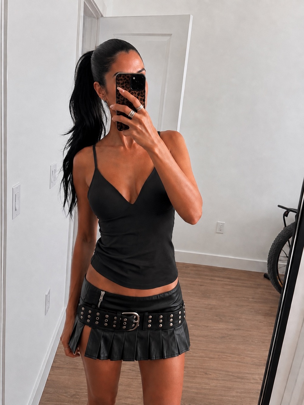 The Kript Pleated Leather Studded Micro Mini Skirt
